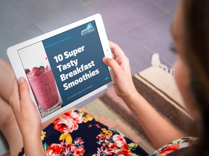 Woman looks at Eivissa Health and Fitness smooties ebook on an iPad